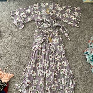 Two piece flowy pants and cropped top that ties in the middle.